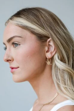 Raven Gold Knot Hoop Earrings -Trendy Clothing Store shopdressup gold hoop earrings 6 7616689b 3561 447c b2e1 42fcff3deb48