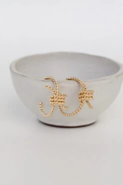 Raven Gold Knot Hoop Earrings -Trendy Clothing Store shopdressup gold hoop earrings 9 fef56fd4 c0ba 4fd0 b542 9b6cf124ce5f