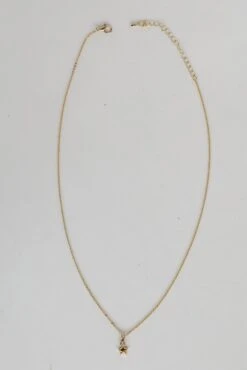 Eleanor Gold Rhinestone Star Charm Necklace -Trendy Clothing Store shopdressup gold star necklace 3 5ac2a9f4 9f0e 4034 a648 443b5f509680